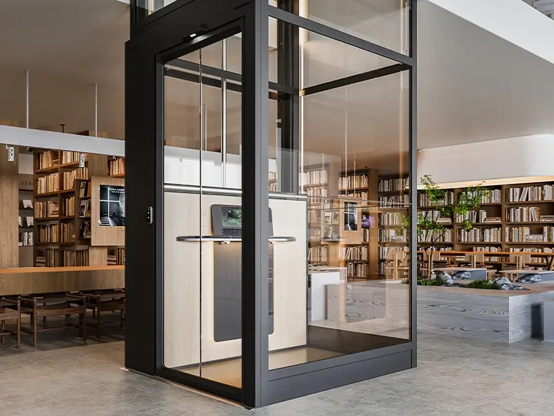Frameless glass design of the Cibes Air platform lift with a 1000 mm wide cabin, offering an open and spacious home lift experience.