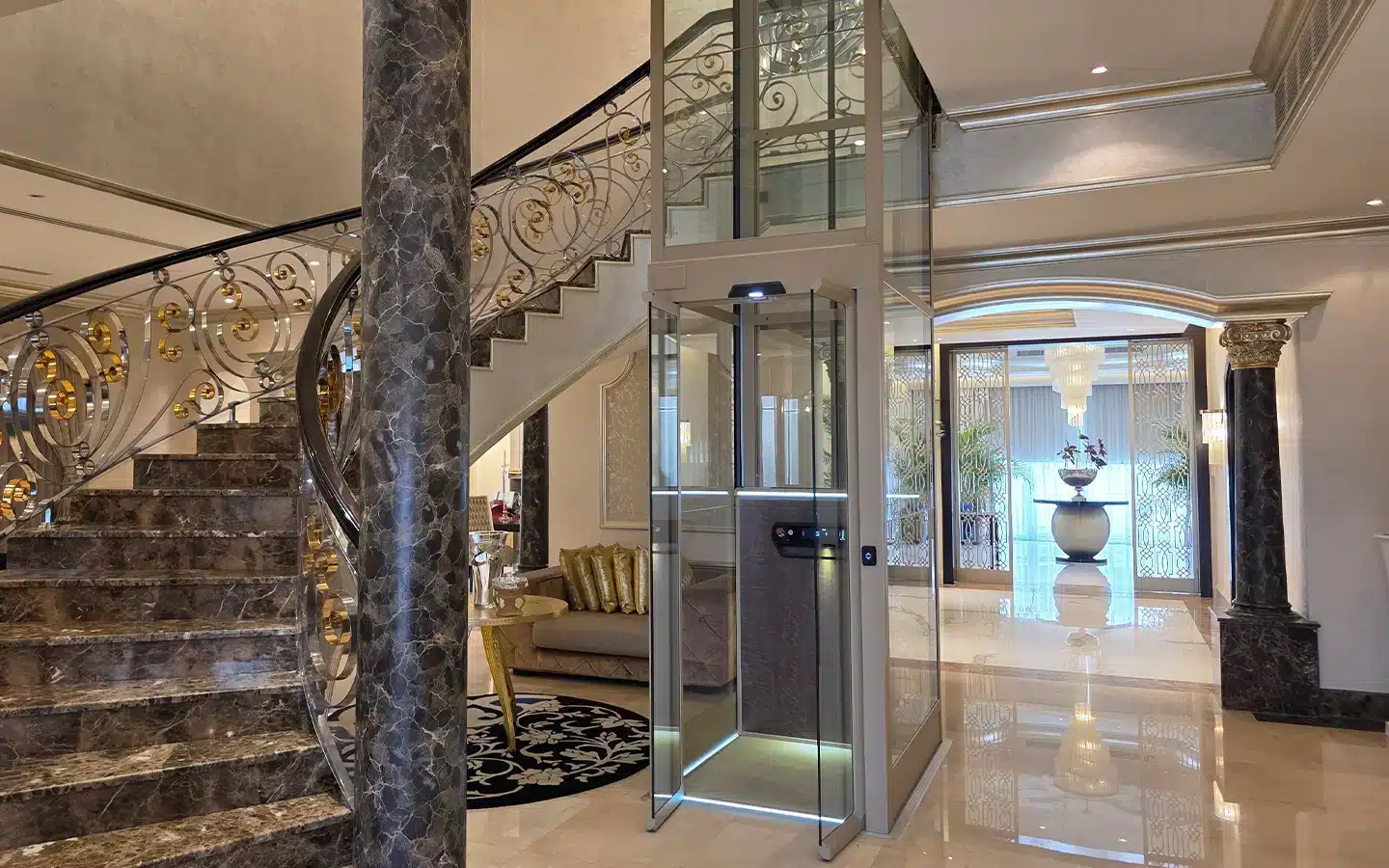 Luxury Cibes home lift installation in a private Dubai villa beside a marble staircase and elegant interior.