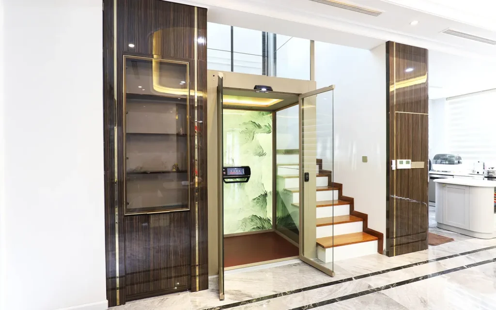 Cibes V90 home lift installed beside a staircase in a modern villa, featuring a quiet screw-driven system.