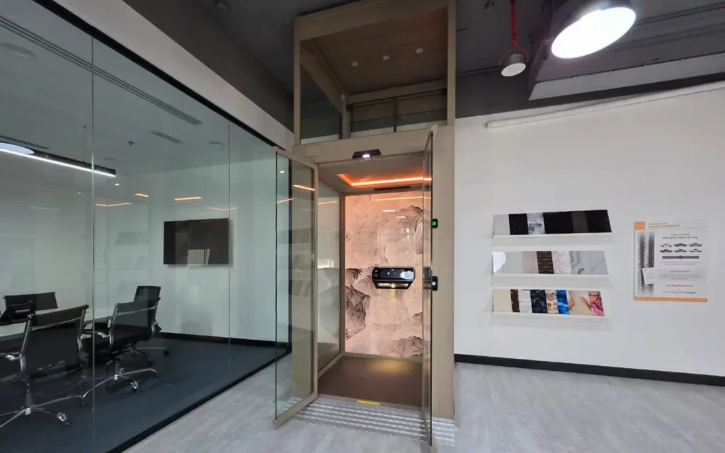 Cibes V90 demo home lift installed inside the Dubai showroom.